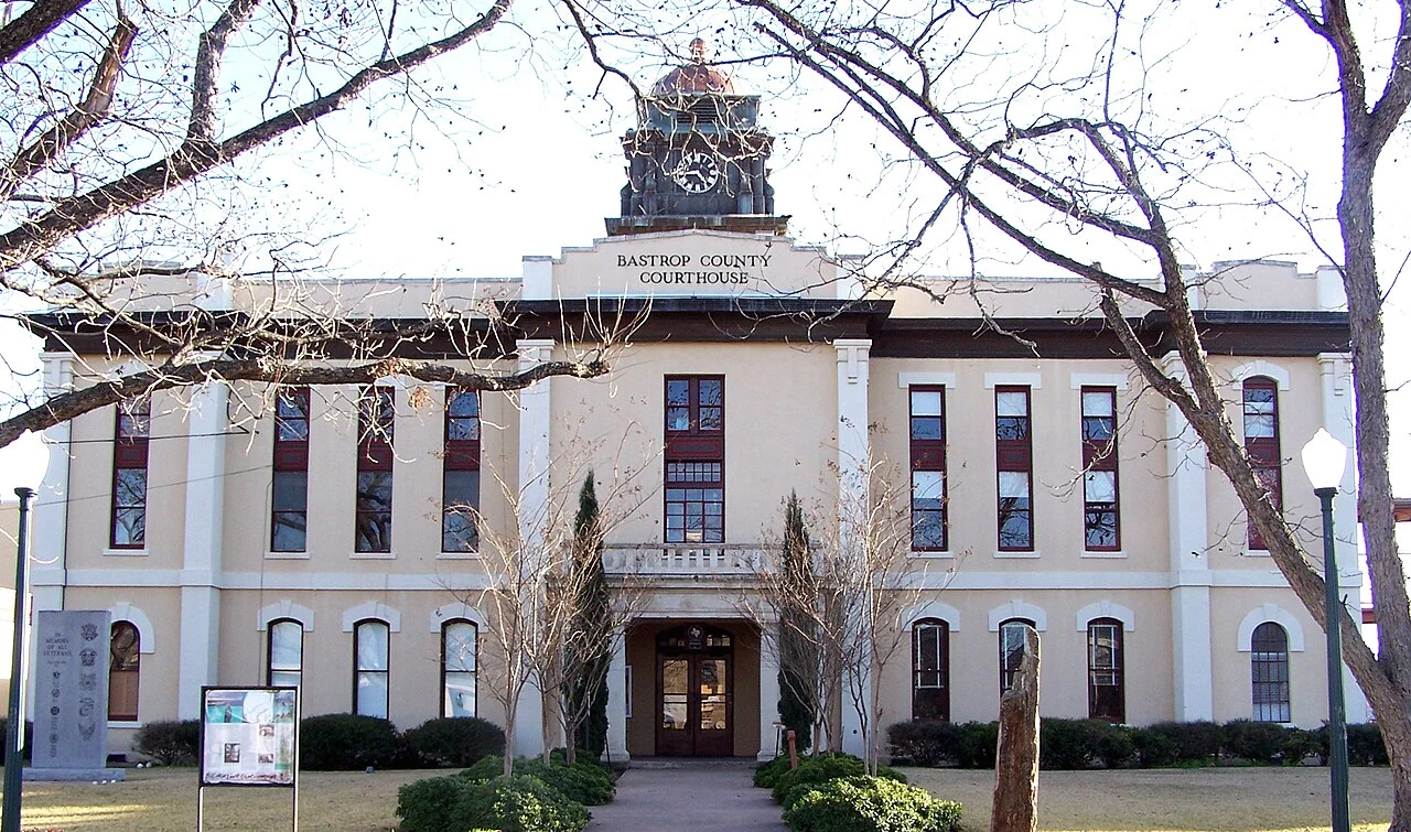The classical revival style Bastrop County Courthouse in Bastrop, Texas, United States was built in 1883 to replace the 1852 courthouse that burned. The Courthouse and Jail Complex were listed on the National Register of Historic Places on November 20, 1975.