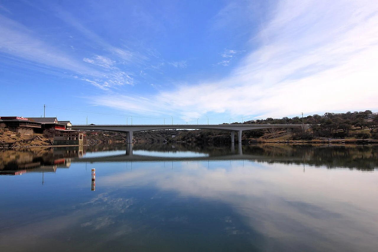 Lake Marble Falls in Marble Falls, Texas, United States. The Marble Falls Bridge is in the background. The bridge carries U.S. Route 281 over the lake.