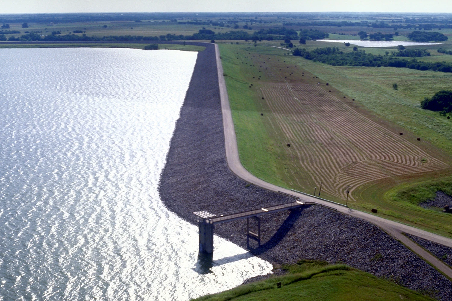 Aerial view of Bardwell Lake and Dam in Ellis County near Ennis, Texas, USA. The lake is nearly five miles long but this photograph shows only the dam and southernmost part of the lake. The lake is named for the nearby hamlet of Bardwell, Texas. View is to the east.
