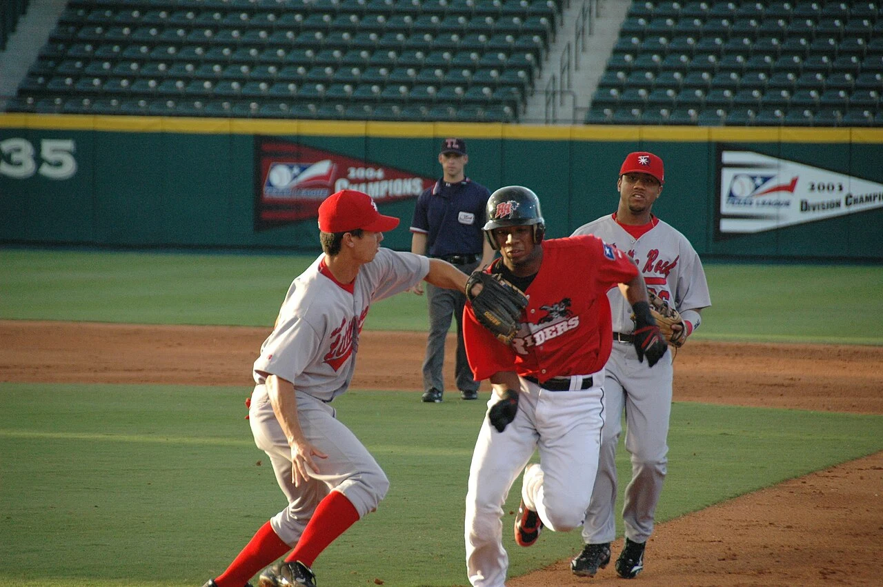Elvis Andrus gets caught in a rundown after trying to stretch a single to a double. The Travelers first baseman handled the play poorly and dropped the ball, allowing Andrus to reach first safely. Andrus stole second shortly after this play.