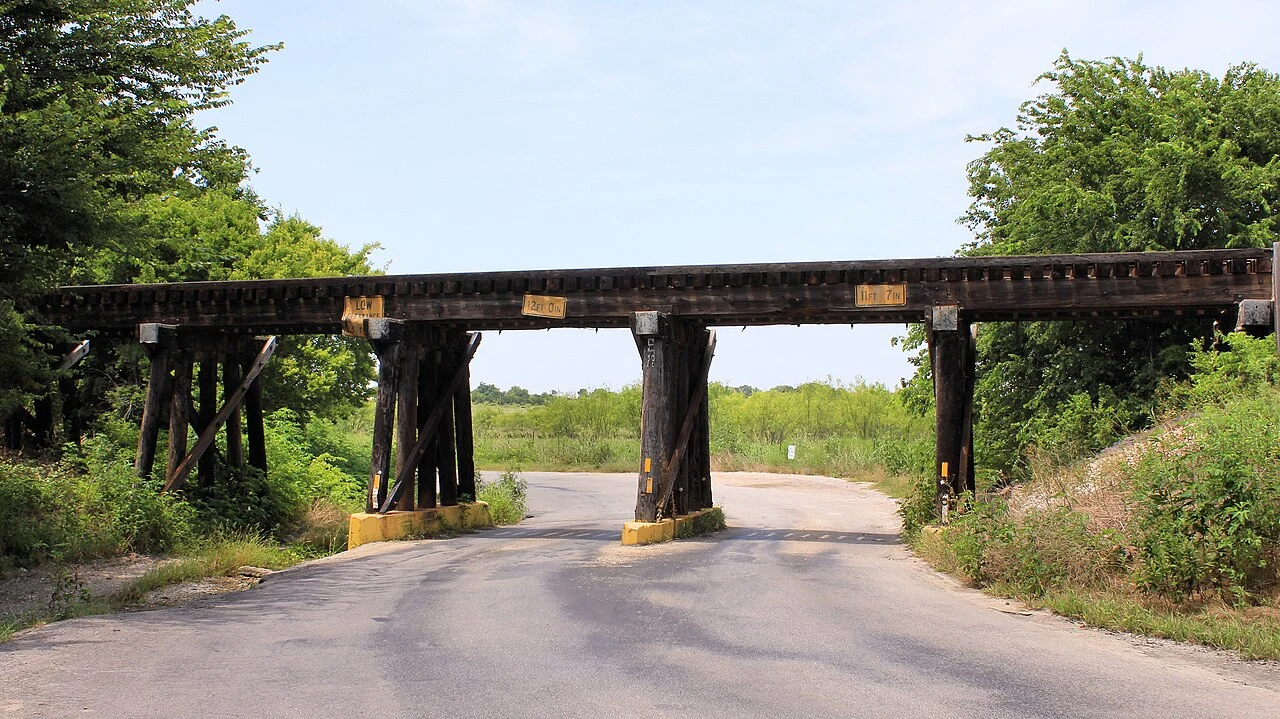 Austin Area Terminal Railroad timber stringer bridge over County Road 330 in Burnet County, Texas, United States.