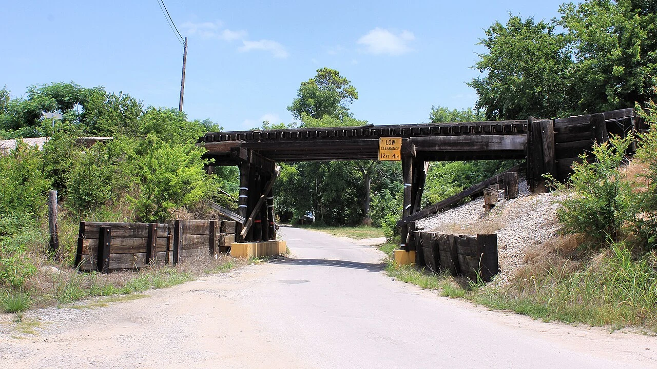 Austin Area Terminal Railroad timber stringer bridge (east) over County Road 340 in Burnet County, Texas, United States.