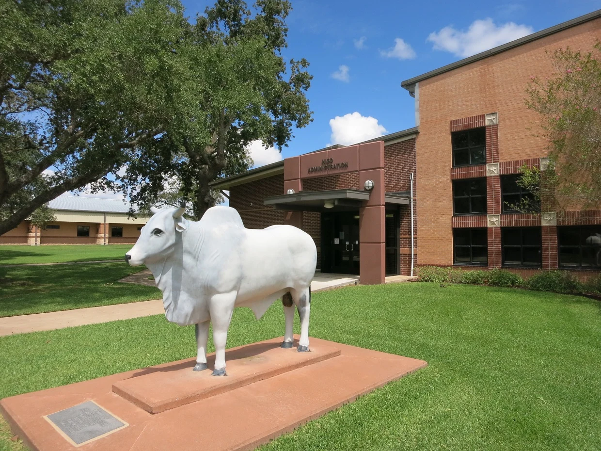 Photo shows the Hallettsville Independent School District offices at 302 N Ridge Street, Hallettsville, TX 77964. View is toward the northeast.