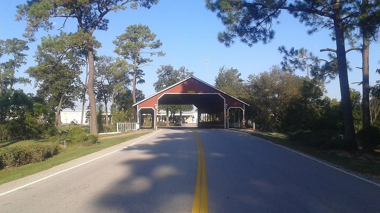Bridge marking the entrance and exit from River Plantation in unincorporated Montgomery County, Texas.