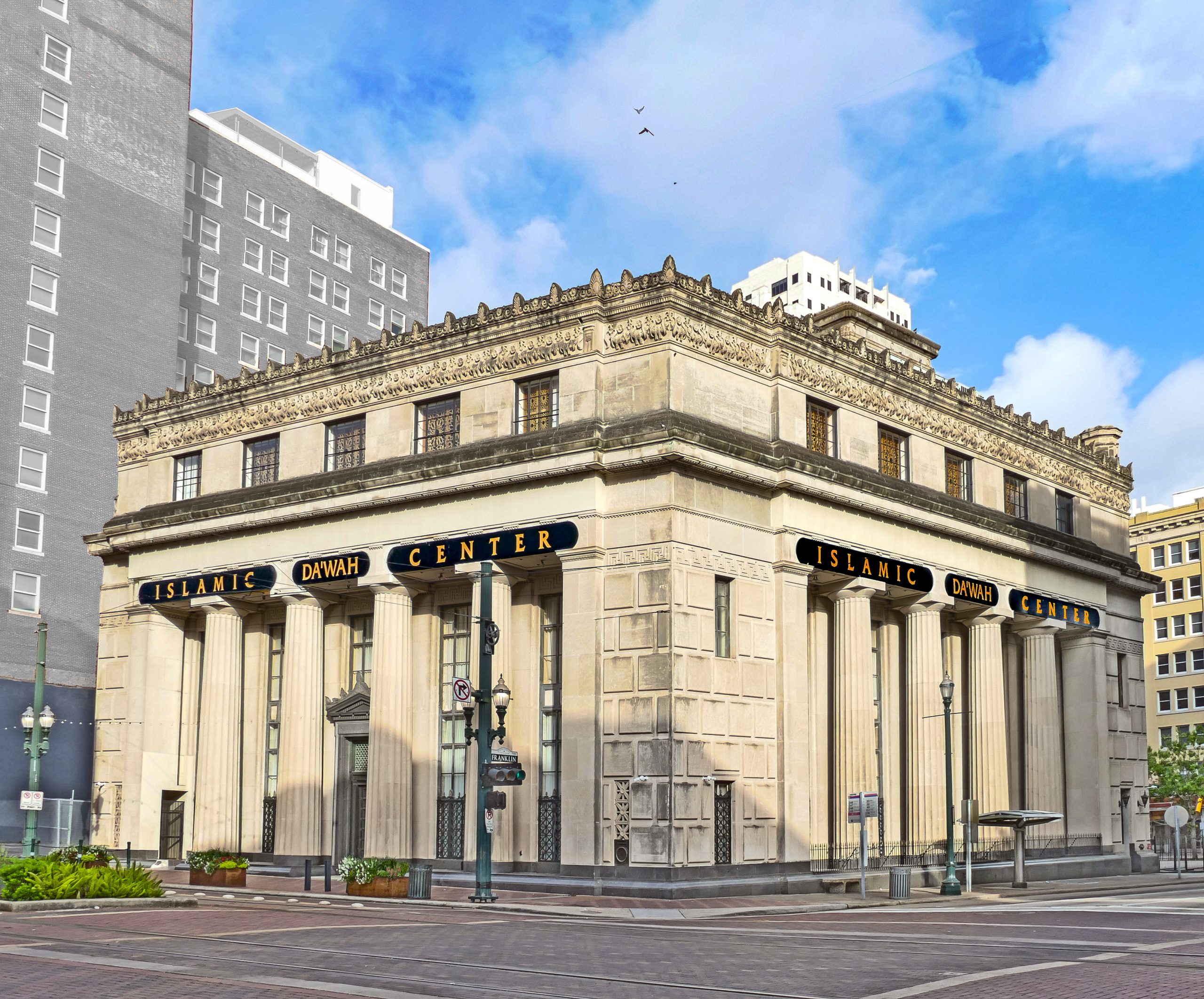 Houston National Bank began as Fox Bank in 1876 and went through several name changes until 1926, when Humble Oil founder Ross S. Sterling bought the bank. Two years after purchasing the bank, Sterling commissioned the firm of his son-in-law, Hedrick and Gottleib, to design the bank’s new building. Hedrick may have been Sterling’s son-in-law, but the firm of Hedrick and Gottleib was the successor to early Texas skyscraper pioneers Saguinet & Staats. This was to be the last of the new banks on Main Street as in 1929 the Depression hit. The interior of this building, now an Islamic center closed to the public, is said to be one of the most elegant bank interiors in Houston. A five-story rotunda, at a height of 56 feet, is supported by eight columns. The floor is a pattern of Roman travertine and Belgian marbles. A marble stairway, in the center of the rotunda, leads to the mezzanine. A bronze fresco surrounds the domed ceiling. The walls are covered with Sienna marble paneling and bronze chandeliers hang throughout.