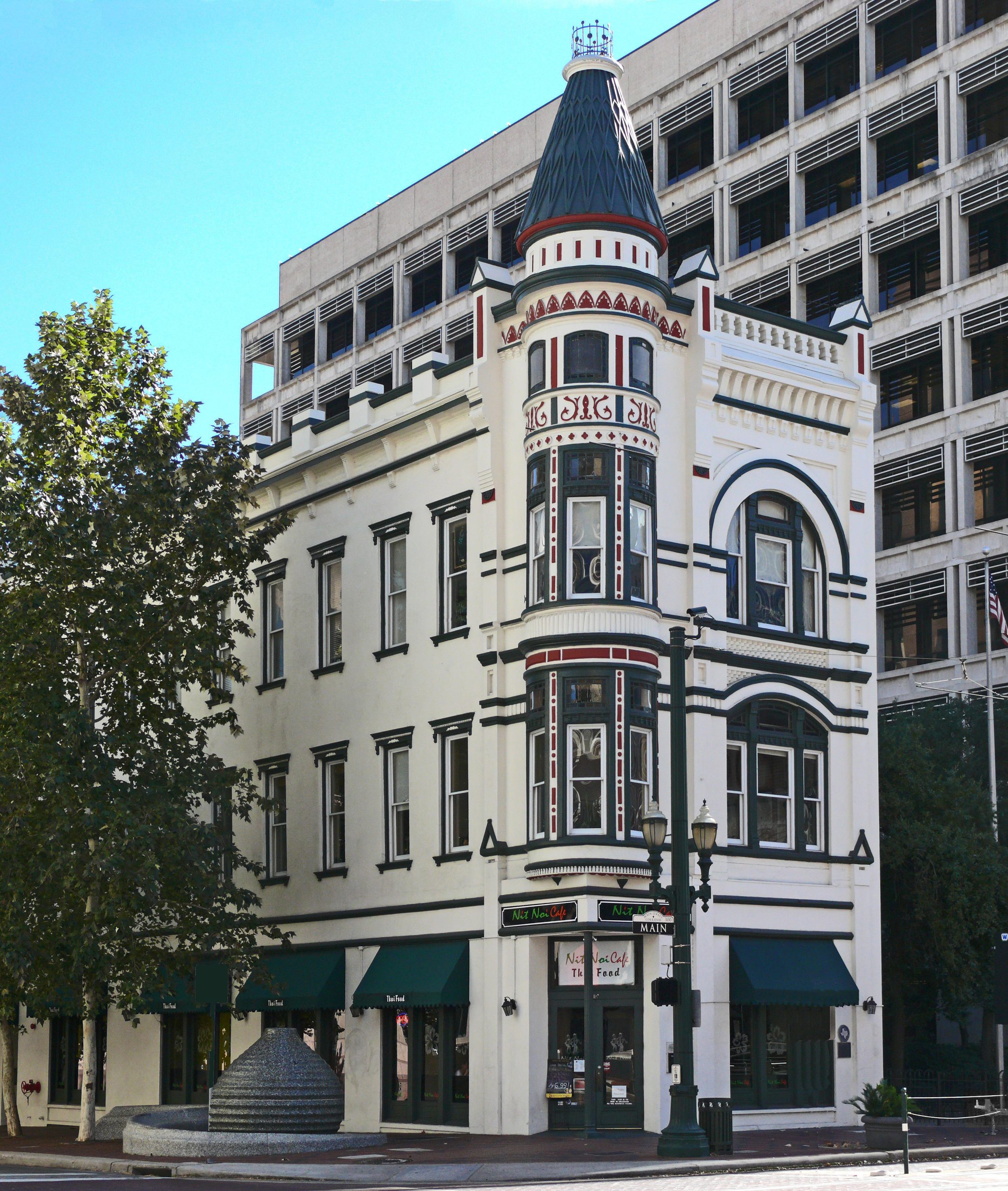 This late-Victorian commercial building with a 3-story corner turret and Eastlake decorative elements was designed by George E. Dickey in 1889. Evidence indicates that the 1889 construction may have been a renovation of an 1861 structure built by William A. Van Alstyne and purchased in 1882 by John Jasper Sweeney and Edward L. Coombs. Gus Fredericks joined the Sweeney and Coombs Jewelry firm before 1889. Coordinates N 29° 45.724 W 095° 21.644