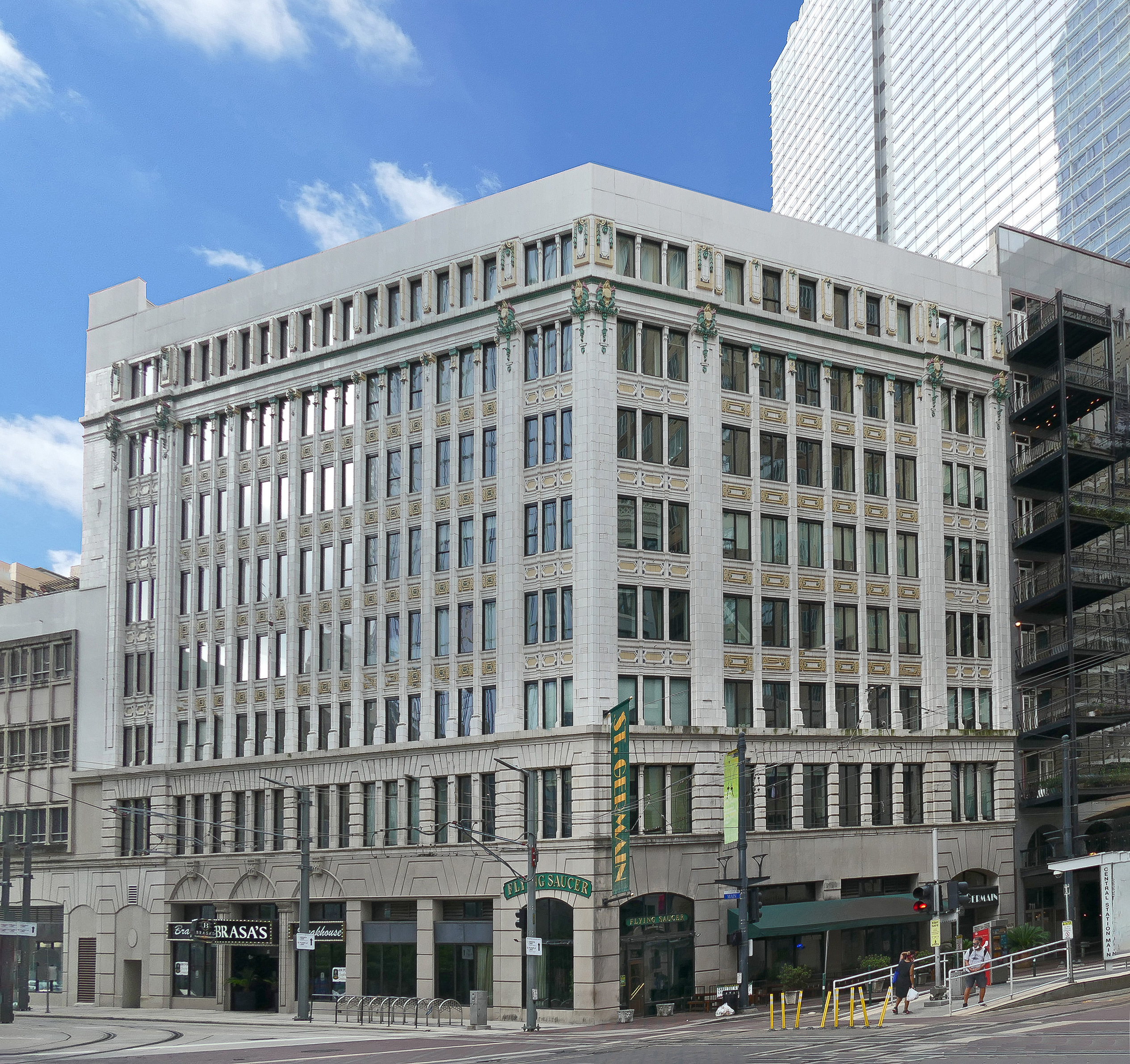The eight-story building is covered almost entirely in terra cotta. A 1983 renovation removed the Kress signage and other architectural features of its retail past, but the building retains the character of a 1913 skyscraper, one of several built in downtown Houston at the time. This S. H. Kress & Co. building was one of the largest the company built, and one of the few to incorporate professional offices. This outpost of the S.H. Kress & Co. five-and-dime, sitting at what was once the head of Houston’s primary retail district, was designed by Kress staff architect Seymour Burrell in 1913. The building was renovated as the St. Germain Lofts. Although Houston’s second Kress store followed the general pattern of the chain at the time, it was still unusual. The typical Kress store contained room enough for retail space and offices on the upper floors. The Houston location was eight stories – enough room for retail on the first 3½ floors, Kress’s offices above, and four floors of office space for lease. The store had two facades, one facing Main, the other facing Capitol. Like most early high-rises, this building emphasized its verticality, with a two-story base, a five-story shaft, and a single story crown. The reinforced concrete frame is sheathed in terra cotta, scored to simulate stone. Kress stores always had colorful ornamentation, and this store was no exception.